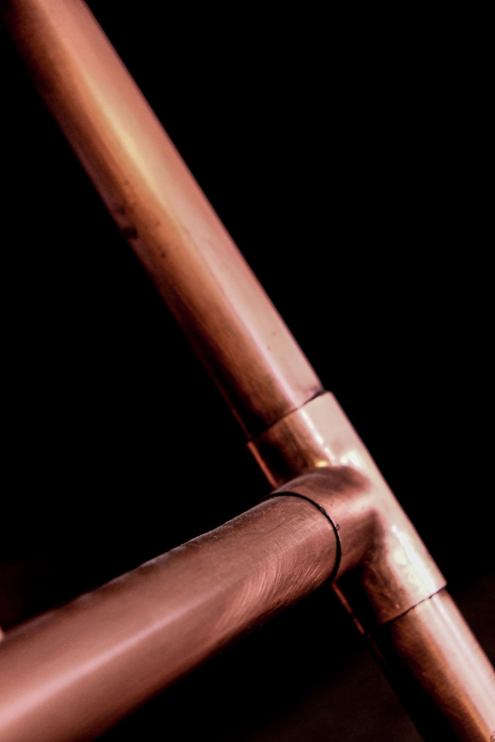 Close-up of a copper water pipe and elbow