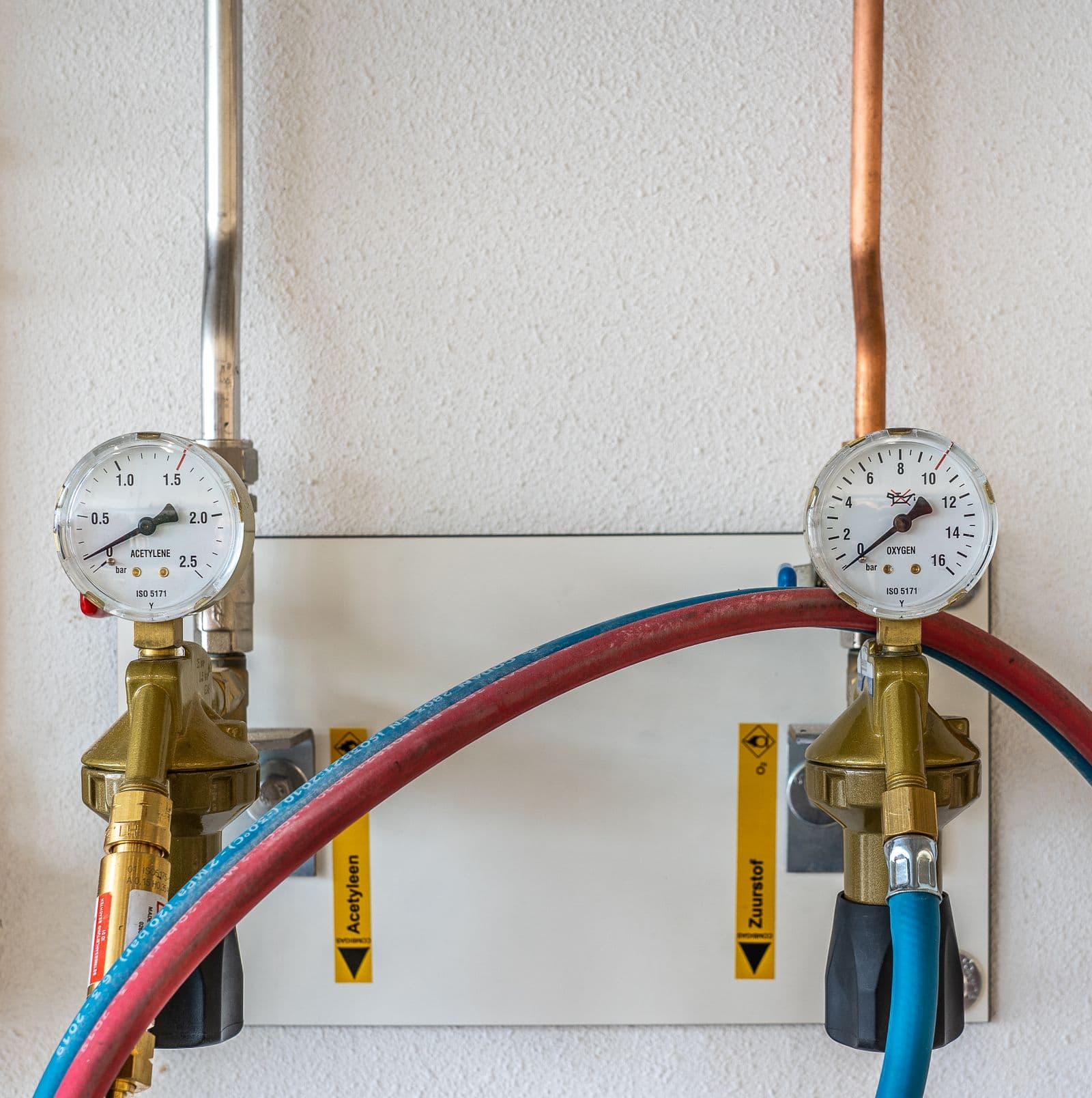 Pressure gauges on brass valves in a water supply line
